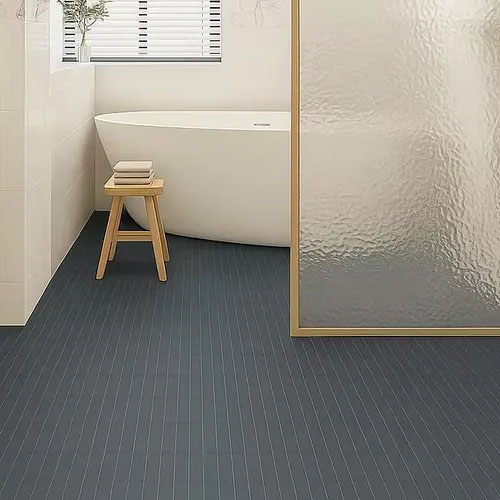 Bathroom flooring with stacked basalt black honed mosaic tiles