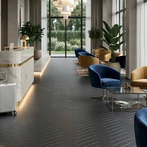 hotel lobby with basalt black cut to size herringbone pattern tiles
