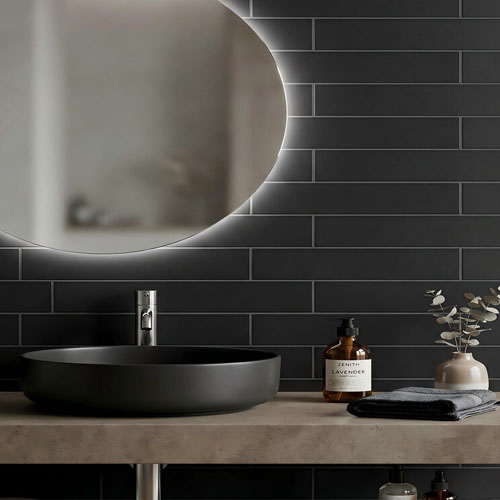 Bathroom vanity wall with basalt black subway honed tiles